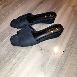 Lulu's black suede slip ons.